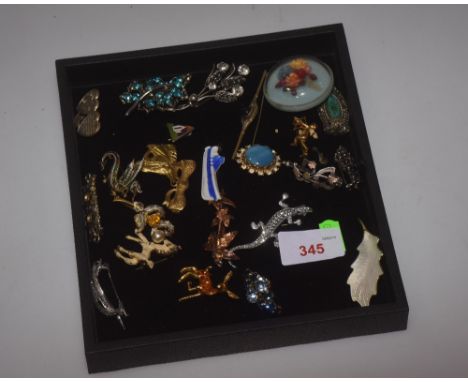 A collection of costume jewellery including enamel animal brooches including a dragon brooch, various paste brooches and Vict