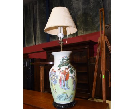 A Chinese vase mounted as a lamp