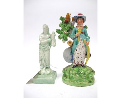 An Early XIX Century Walton Style Pearlware Figure of a Lady, holding a bow and arrow, upon rocky oval base, 18cm high; A XIX