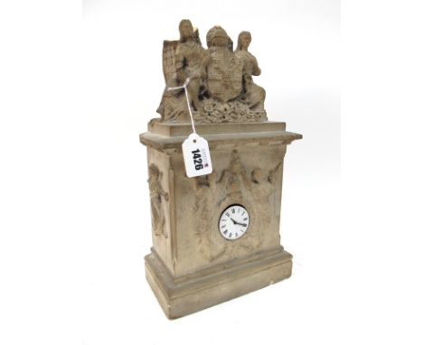 A Late XIX Century Mantel Clock, the carved stone rectangular case moulded in relief with figures and surmounted by heraldic 