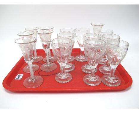 A Set of Six XVIII Century Style Wine Glasses, the bell bowls each etched with flowers and butterflies, raised upon white ena