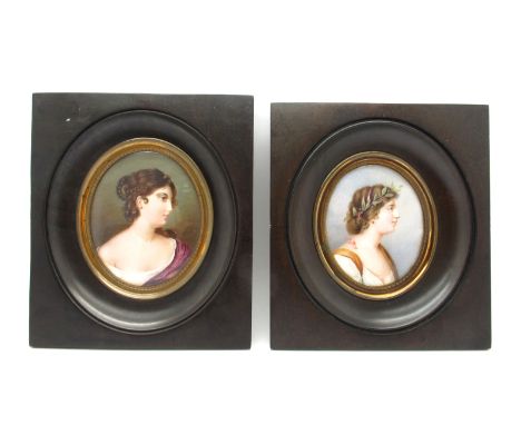 A Pair of Late XIX Century Oval Portrait Miniatures Painted on Ivory, of ladies, one with a white and ochre dress and laurel 