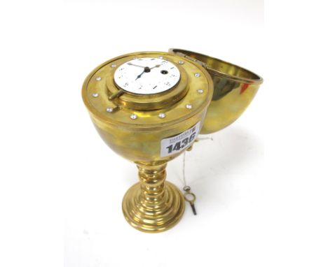 A c.XIX Century Desk Clock, the high domed brass case fitted to the interior with a Swiss pocketwatch movement, the white ena