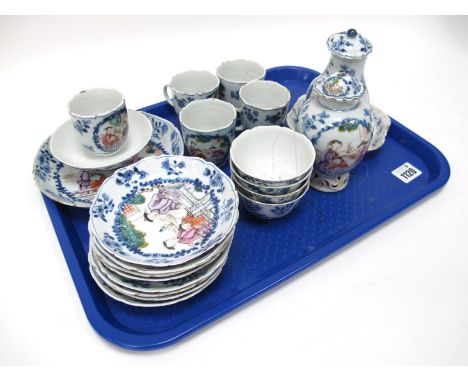 A Mid XIX Century Chinese Porcelain Part Tea/Coffee Service, painted in enamels with figures on terraces in panels within blu