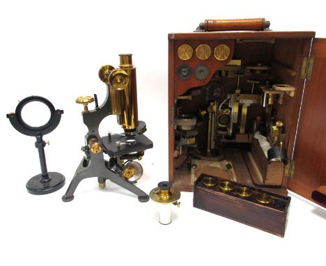 An Early XX Century W. Watson &amp; Sons Ltd Brass and Black Lacquered Metal Microscope, with lens and accessories, makers ma