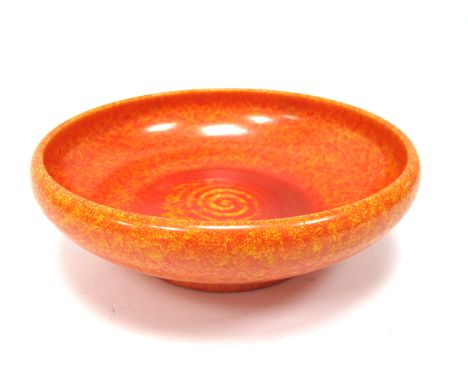 A Pilkington's Royal Lancastrian Pottery Bowl, of shallow circular form decorated in a mottled orange glaze with a spiral cen