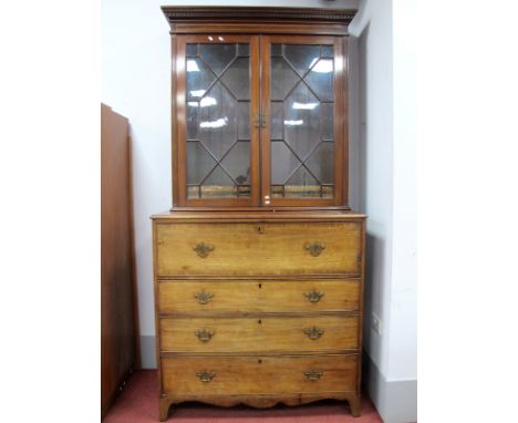 An Early XIX Century Mahogany Secretaire Chest of Drawers, the top with moulded edge, cross banded fall front drawer to fitte