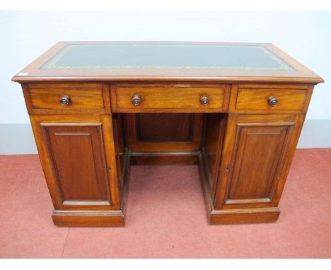 A Late XIX Century Mahogany Pedestal Desk, with crossbanded top and leather scriver, three drawers, the twin pedestals each w