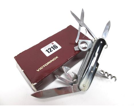 A Victorinox 'Champion' Pocket Knife, with twelve blades/implements, horn scales, in original case and leaflet, 9cm closed.