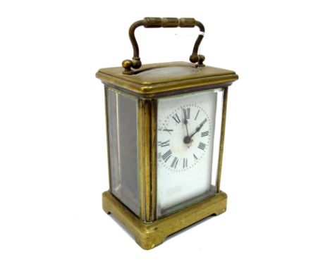 A French Brass Cased Carriage Clock, the white enamel dial with Roman numerals, the back plate engraved 'D H. France' the top