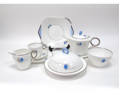 A Shelley Porcelain 1930's Art Deco Part Tea Service, decorated with stylised flowers within silver lustre and blue bands, pr