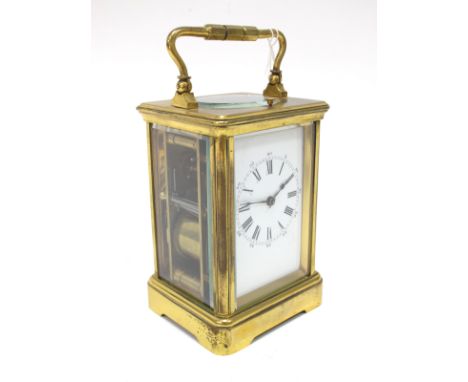 A Mid XX Century French Repeater Brass Cased Carriage Clock, the white enamel dial with Roman numerals, with fluted columns a