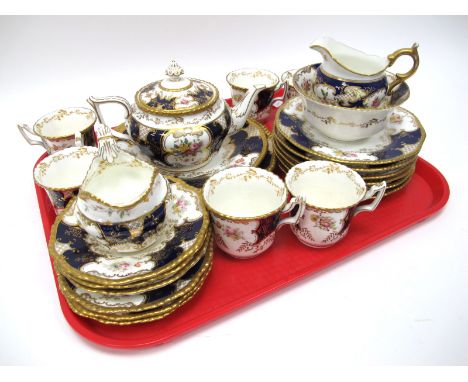 A Coalport Porcelain 'Batwing' Pattern Part Tea Service, printed and painted with floral sprays within dark blue and gilt bor