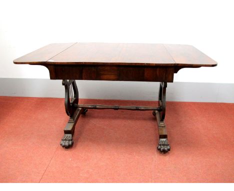 A XIX Century Rosewood Sofa Table, with drop leaves and two drawers, on lyre supports, centre rail, on claw feet, 130cm wide.