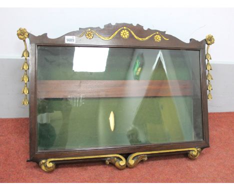 A Mahogany Wall Hanging Display Cabinet, the shaped top with gilt decoration, glazed door, the base with carved 'C' scroll de