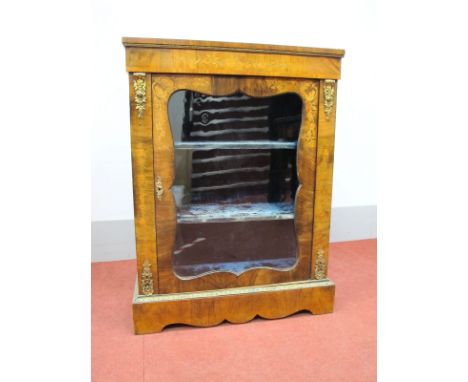 A Mid XIX Century Walnut Marquetry Inlaid Pier Cabinet, with ormolu mounts and glazed door on a shaped plinth base, 81cm wide