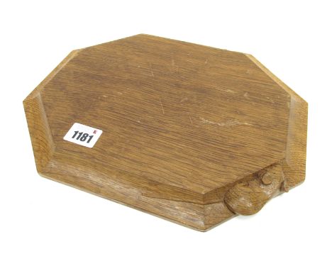 A Robert Thompson Mouseman Oak Bread Board, of rectangular form with canted corners, carved mouse signature, 30 x 24.5cm.