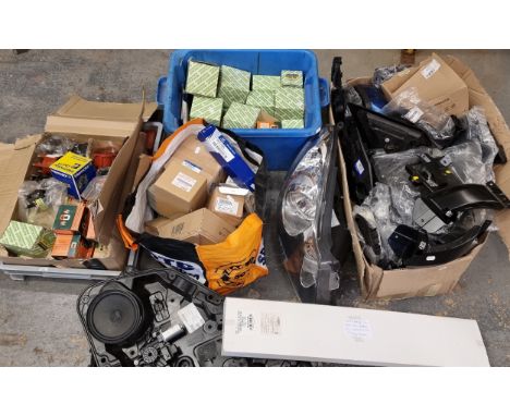 An autojumblers lot, to include an Audi A4 wind deflector, various distributors, and a headlamp unit
