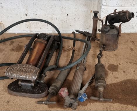 A Duplex Kismet Master foot pump, a Tecalemit brass grease gun, another pump, a blow lamp and a cutting torch.
