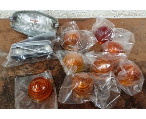 A collection of 8 glass Lucas indicator lens, as used on Morris Minor and BMC, a NOS Lucas reversing lamp and a number plate 