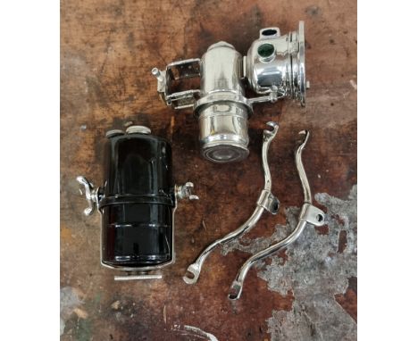 A restored King of the Road acetylene 3 1/2" motorcycle lamp, with separate carbide container and a pair of brackets.