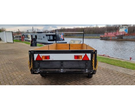 A twin axle unbraked trailer with lighting board and ladder rack, Internal dimensions, 144 x 295cm