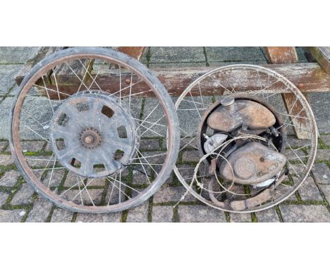 A Cyclemaster engine mounted in a wheel, serial number 136626 together with a wheel hub.
