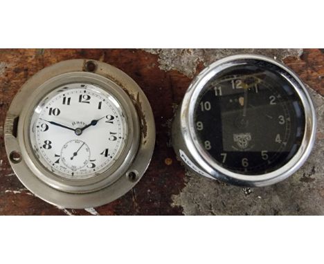 A Swiss 8 day bezel winding dashboard mounted clock, overall diameter 8cm, working but not guaranteed and a Smiths 8 day dash