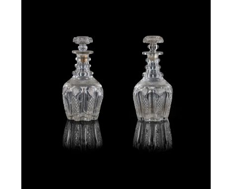 PAIR OF FULL BOTTLE TRIPLE NECK RING DECANTERS AND A MATCHING HALF BOTTLE DECANTER EARLY 19TH the fluted body of each cut wit