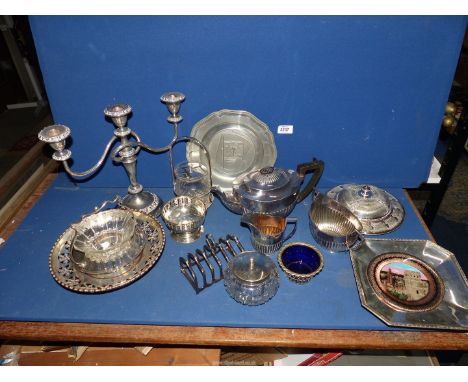 A quantity of plated items including three piece teaset, candelabra, muffin dish, toast rack, etc.