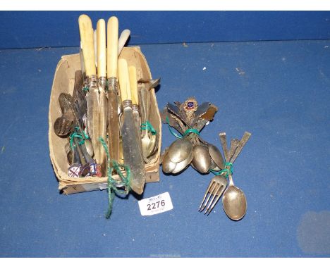 A small quantity of cutlery to include: a silver Christening fork and spoon set, epns souvenir forks, fish knives, etc.