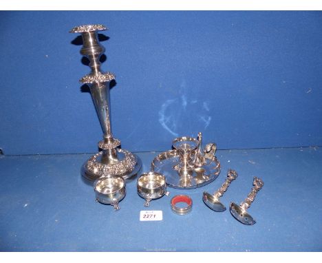 A small quantity of silver plate to include: an ornate candle stick, a chamberstick, a pair of salts and two spoons.
