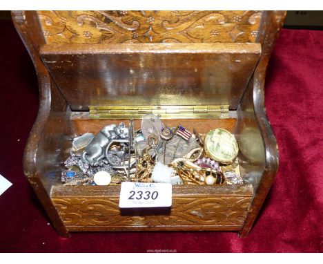 A jewellery box containing brooches, tie pins, cuff links, stick pins, etc.