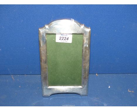 A Silver photograph frame, Birmingham 1915, makers Walker & Hall, 8" x 5" overall, 5 1/2" x 3 1/2" aperture.