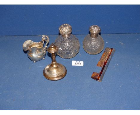 Two hobnail glass perfume Bottles, both having silver lids (one with stopper), silver candlestick, base a/f., silver comb (te