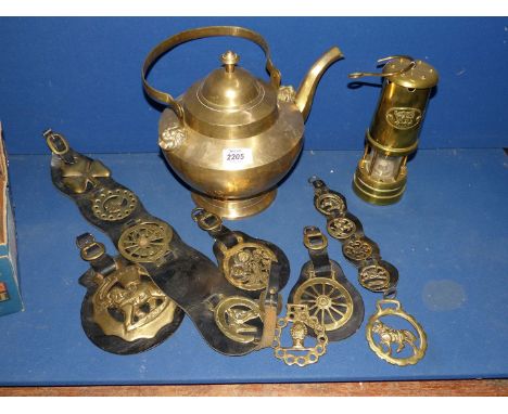 A quantity of brass including a large teapot, horse brass and a lantern.