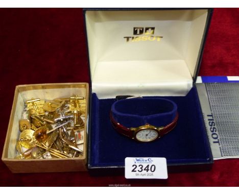 A boxed Tissot Boutique ladies wrist watch, along with a small quantity of cufflinks.