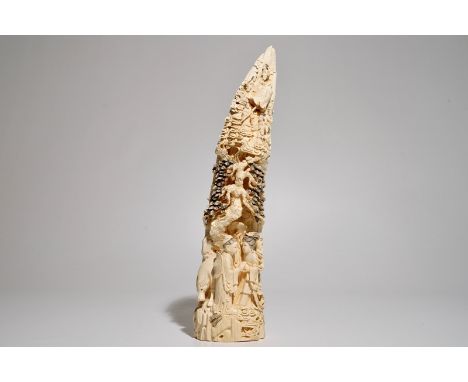 A Chinese carved ivory tusk with a marriage scene, ca. 1900  Dim.: 41 x 12,5 x 8 cm  Condition reports and high resolution pi