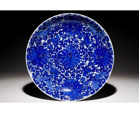 An exceptionally bright blue and white Chinese lotus scroll dish, Kangxi  Dia.: 37,5 cm  Condition reports and high resolutio