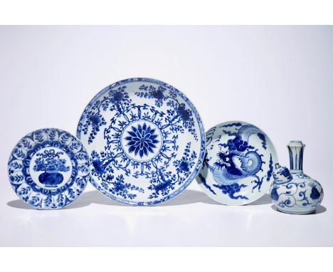 A Chinese blue and white kendi, Ming, Wanli and three blue and white plates, Kangxi  H.: 18,5 cm (the kendi) Dia.: 35,5 cm (t