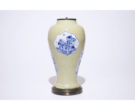 A Chinese blue and white on carved celadon-glazed ground vase, mounted as lamp, Kangxi  H.: 41 cm  Condition reports and high