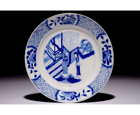 A Chinese blue and white plate with figures in the garden, Kangxi mark and of the period  Dia.: 21 cm  Condition reports and 