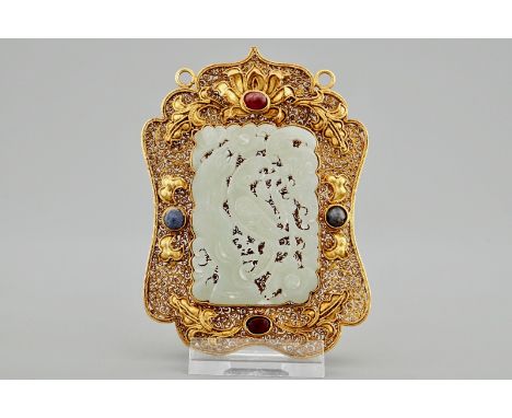 A Chinese gilt filigree silver hat ornament with jade inset, 19/20th C.  Dim.: 10 x 7 cm  Condition reports and high resoluti