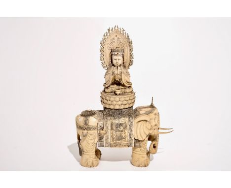 A large Chinese ivory group of Buddha seated on an elephant, late 19th C.  L.: 39 cm - W.: 14 cm - H.: 54 cm  Condition repor