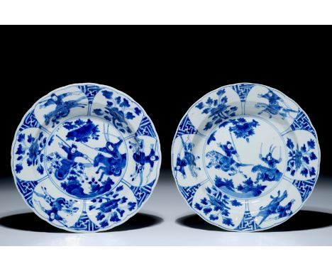 A pair of Chinese blue and white plates with warriors on horseback, Kangxi mark and of the period    Condition reports and hi