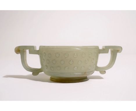 A Chinese pale celadon jade two-handled bowl, 19th C.  L.: 12 cm (ear to ear) - H.: 4 cm  Condition reports and high resoluti