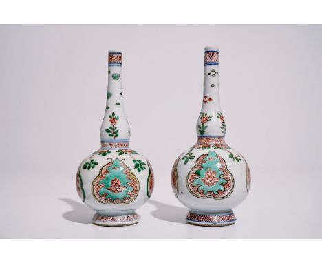 A pair of Chinese famille verte water sprinklers, Kangxi  H.: 17 cm  Condition reports and high resolution pictures are avail