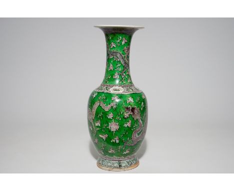 A Chinese green ground dragon vase, a small rouleau vase and a verte biscuit figure, 19th C.  H.: 44,2 cm (the dragon vase)H.