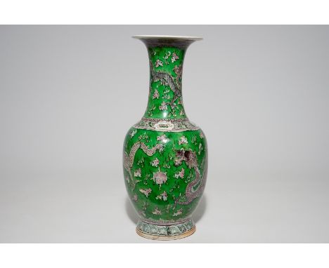 A Chinese green ground dragon vase, a small rouleau vase and a verte biscuit figure, 19th C.  H.: 44,2 cm (the dragon vase)H.