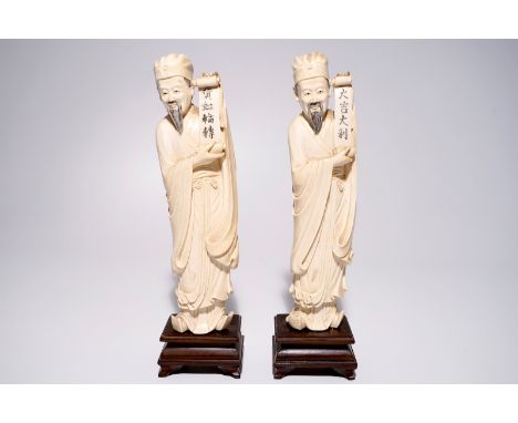 A pair of large Chinese ivory carvings of sages with scrolls, 19th C.  H.: 35,5 cm  Condition reports and high resolution pic